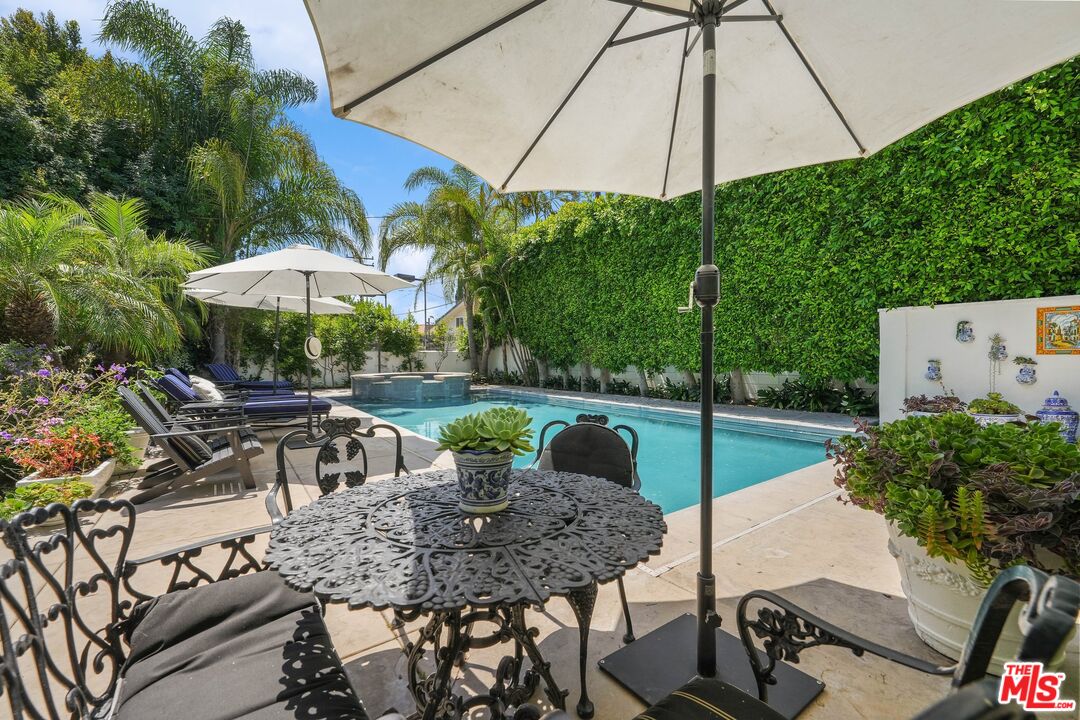 717 North Rodeo Drive Beverly Hills, CA 90210 - Photo 35 of 38 a view of an outdoor sitting area with furniture and backyard