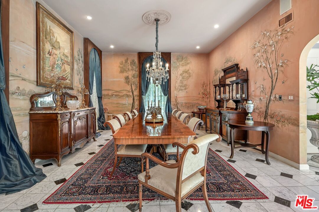 717 North Rodeo Drive Beverly Hills, CA 90210 - Photo 5 of 38 a room with lots of chairs and mirrors