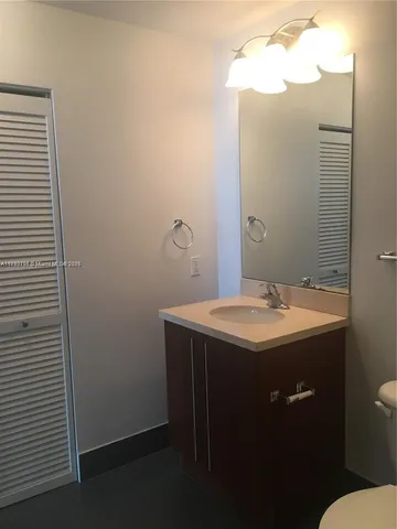 a bathroom with a sink and mirror