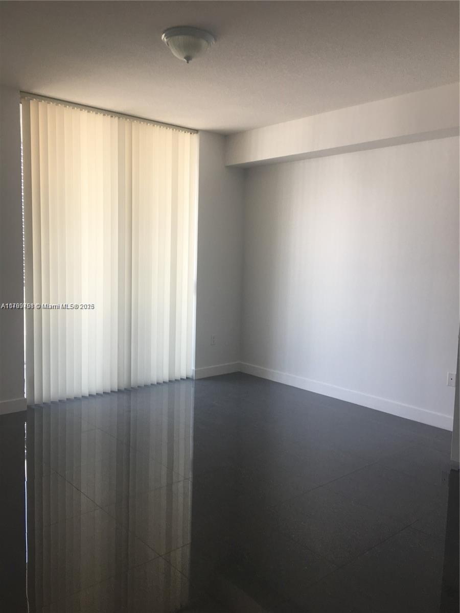 1111 Southwest 1st Avenue, Unit 2223N Miami, FL 33130 - Photo 8 of 23 a view of an empty room with a window