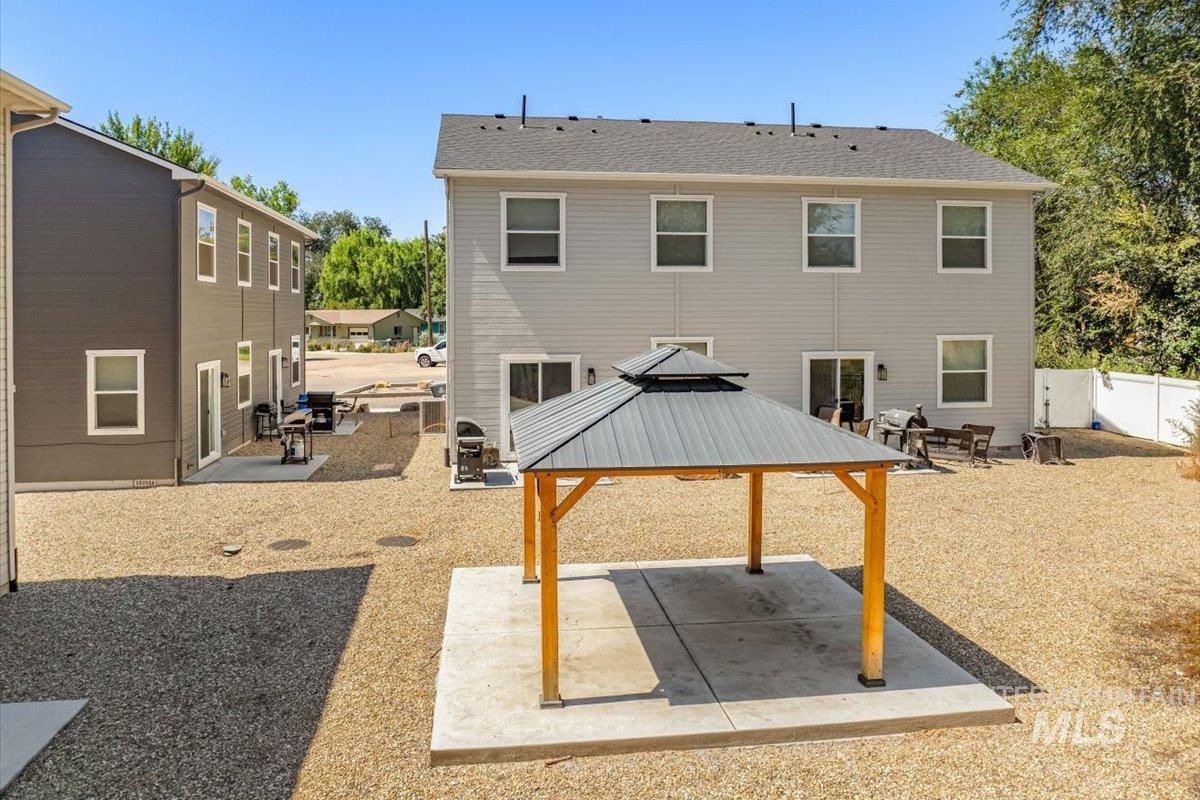 302-304 North 7th Street Parma, ID 83660 - Photo 4 of 20 Rear view of property with a patio area and a gazebo