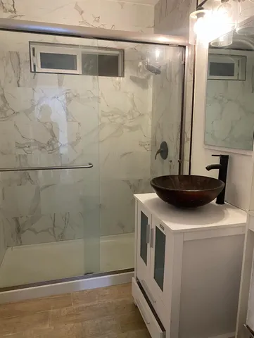 a bathroom with a sink and a mirror