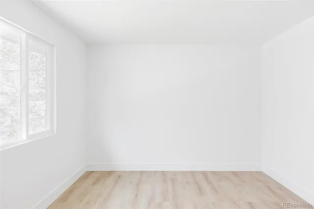 a view of a room that has a window in it