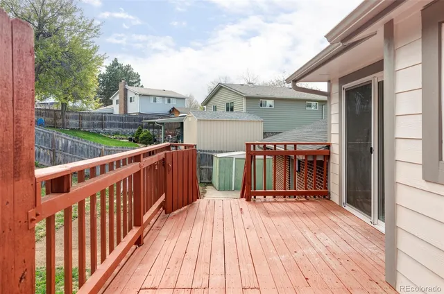 a view of a house with wooden deck
