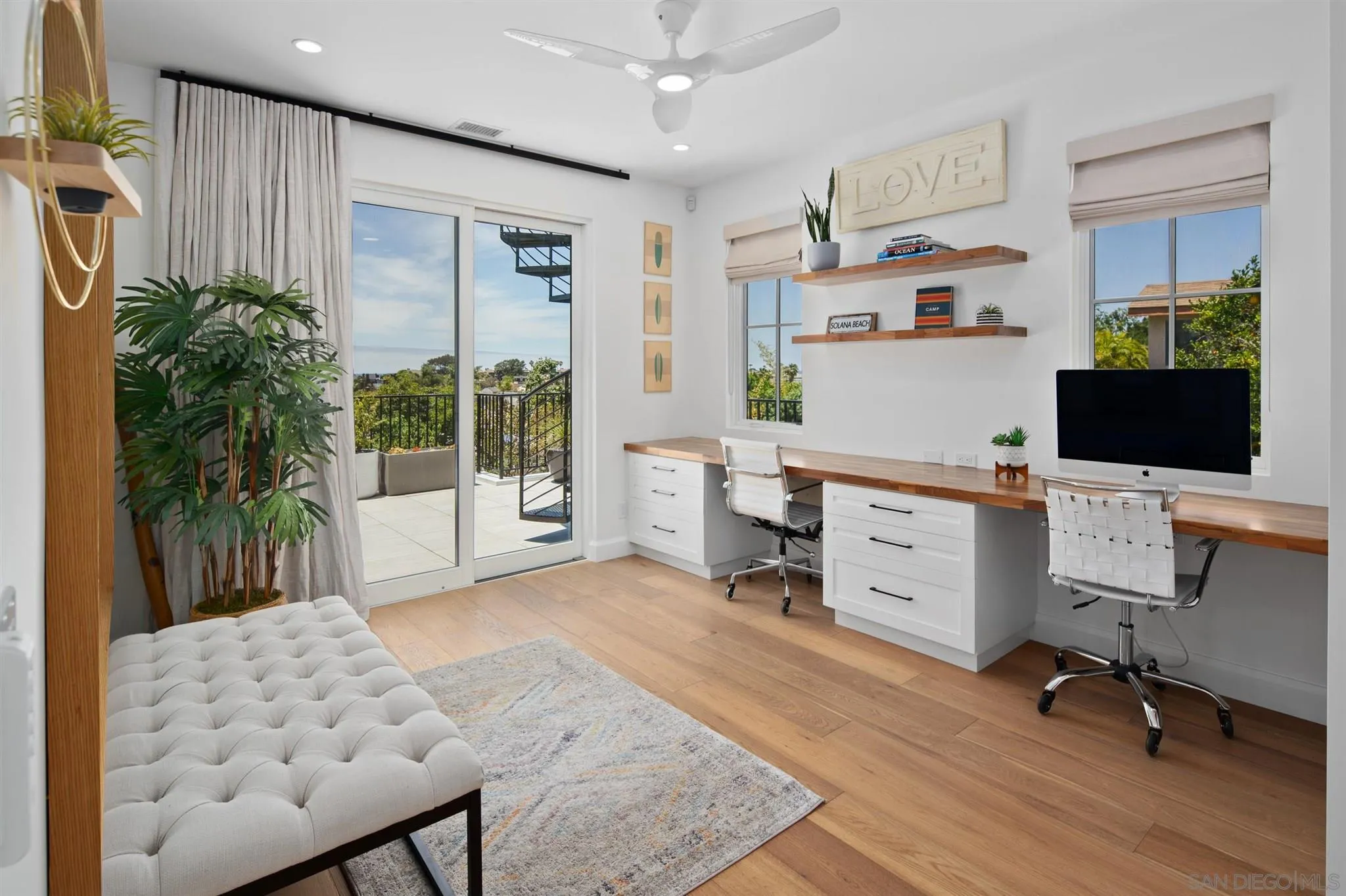 425 South Rios Avenue Solana Beach, CA 92075 - Photo 14 of 50 a view of a workspace with furniture and a potted plant