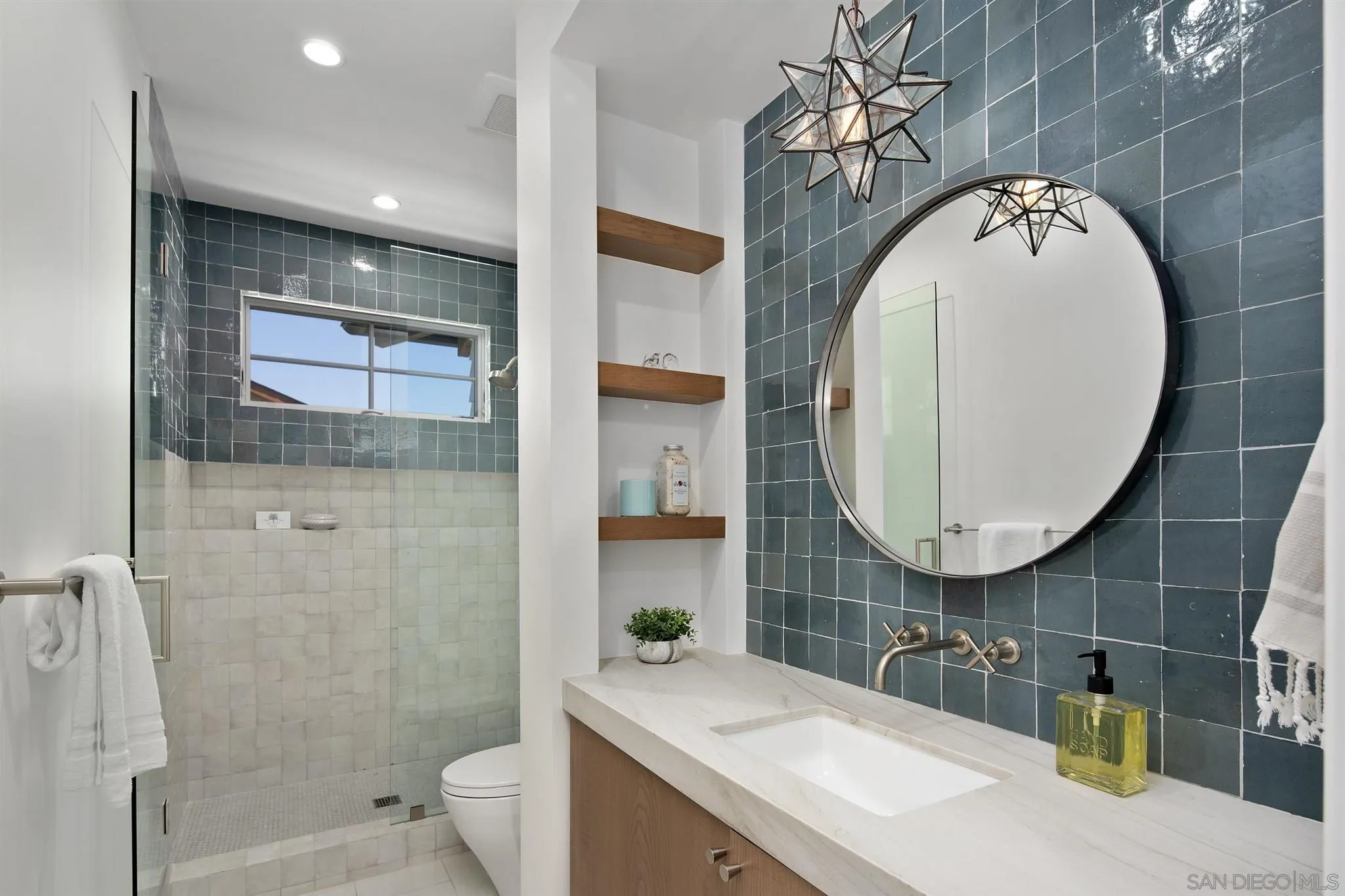 425 South Rios Avenue Solana Beach, CA 92075 - Photo 15 of 50 a bathroom with a toilet sink and mirror