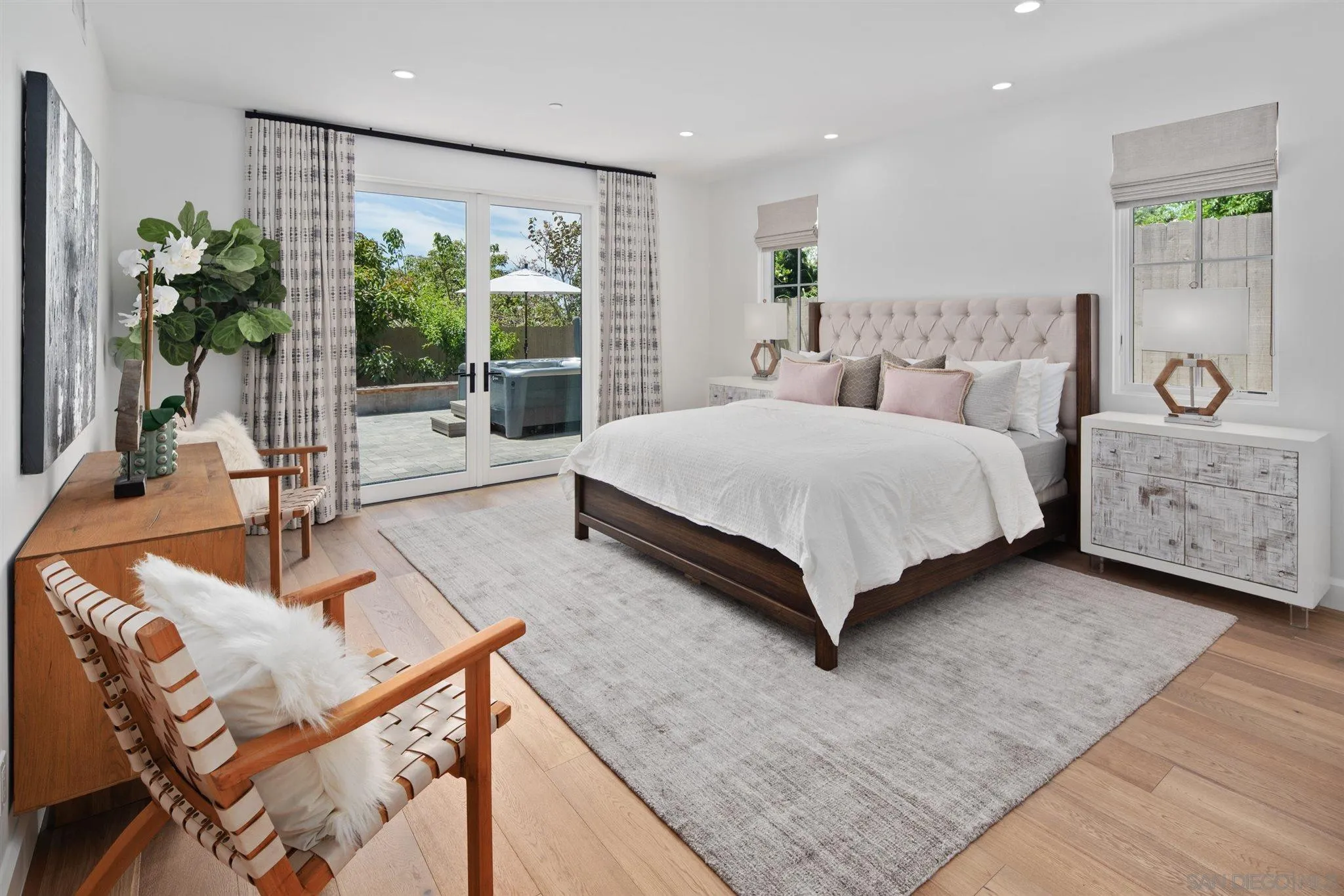 425 South Rios Avenue Solana Beach, CA 92075 - Photo 17 of 50 a spacious bedroom with a large bed and a large window