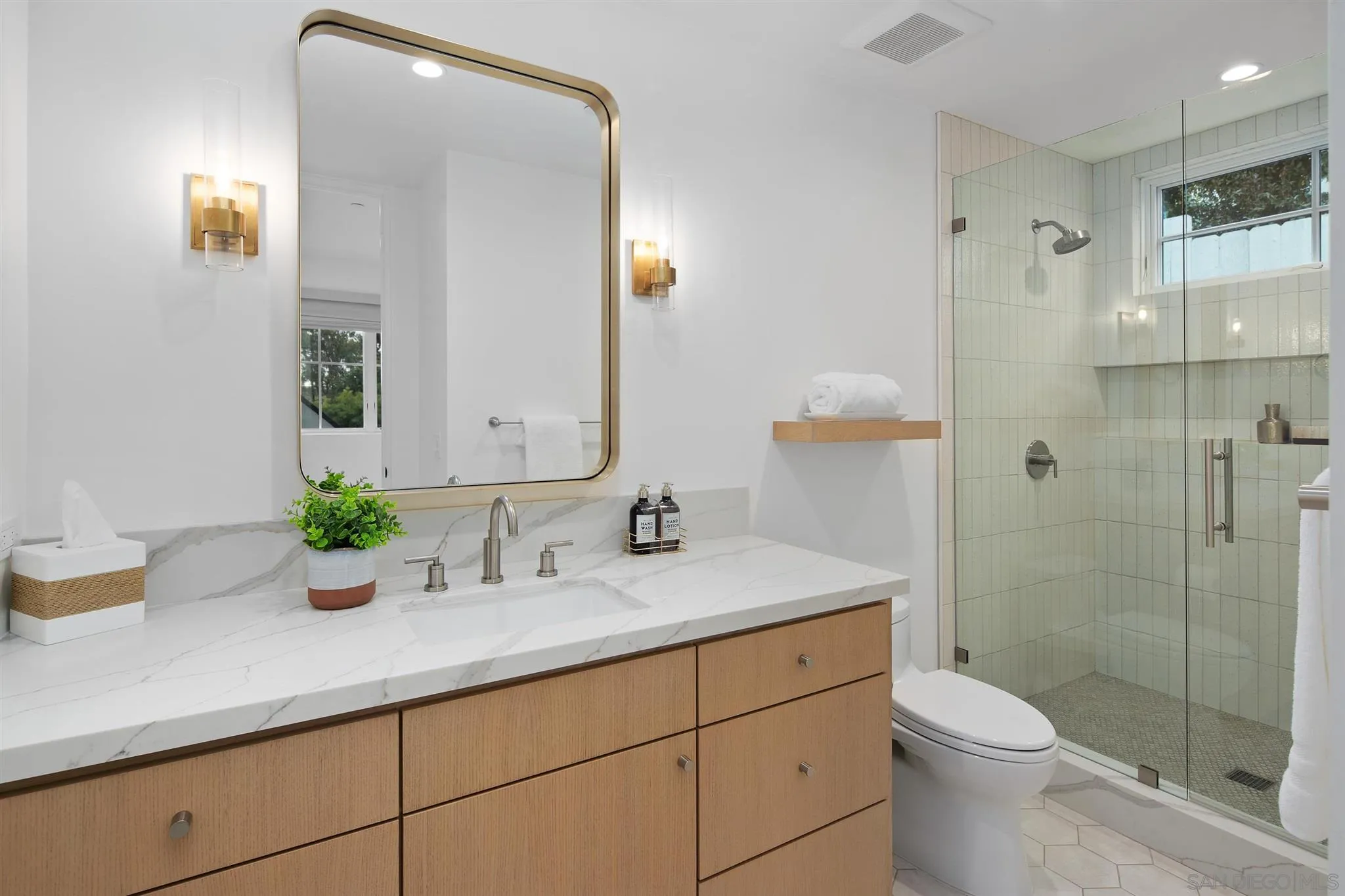 425 South Rios Avenue Solana Beach, CA 92075 - Photo 26 of 50 a bathroom with a granite countertop toilet sink and mirror