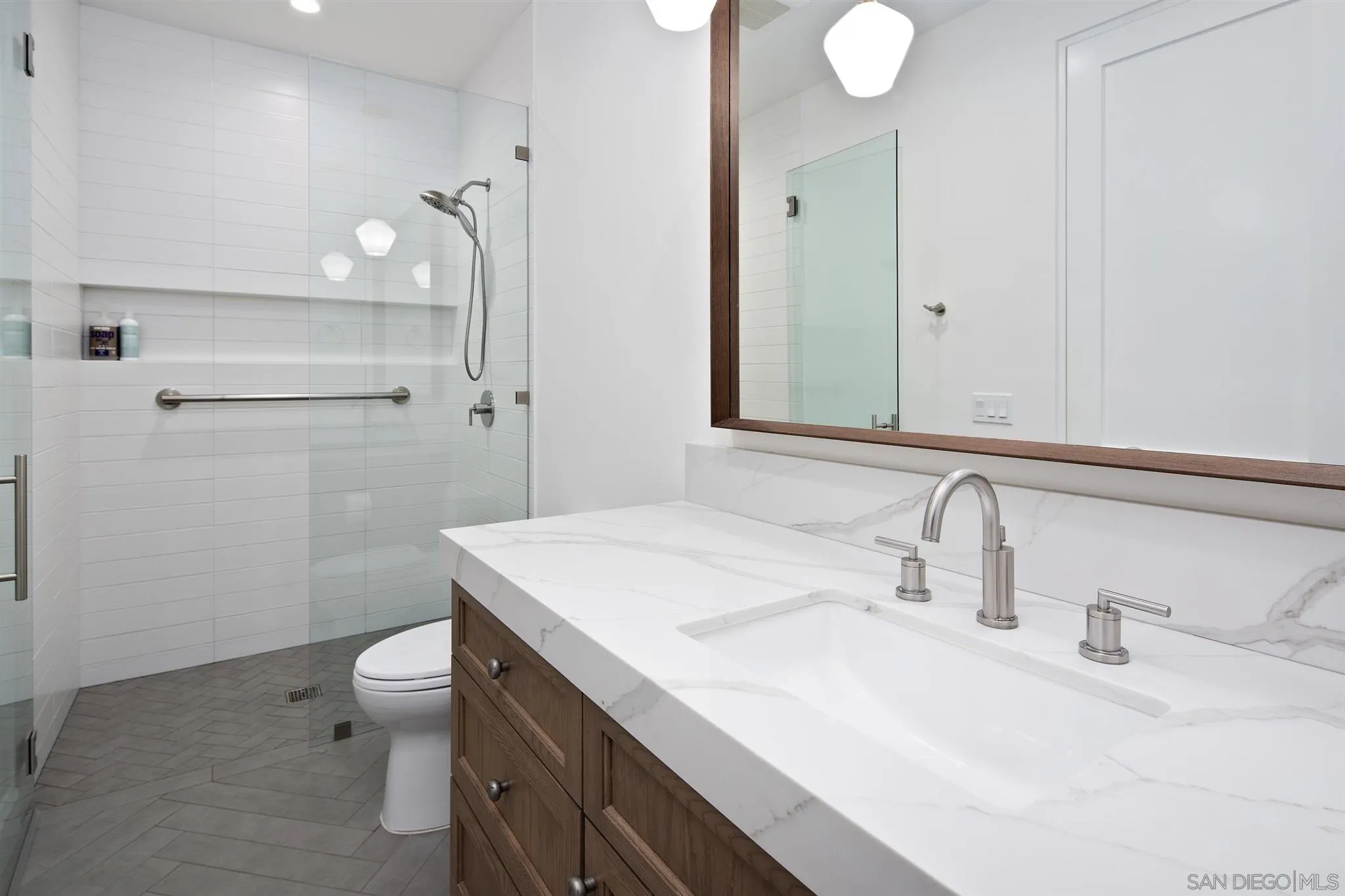 425 South Rios Avenue Solana Beach, CA 92075 - Photo 35 of 50 a bathroom with a sink toilet and shower