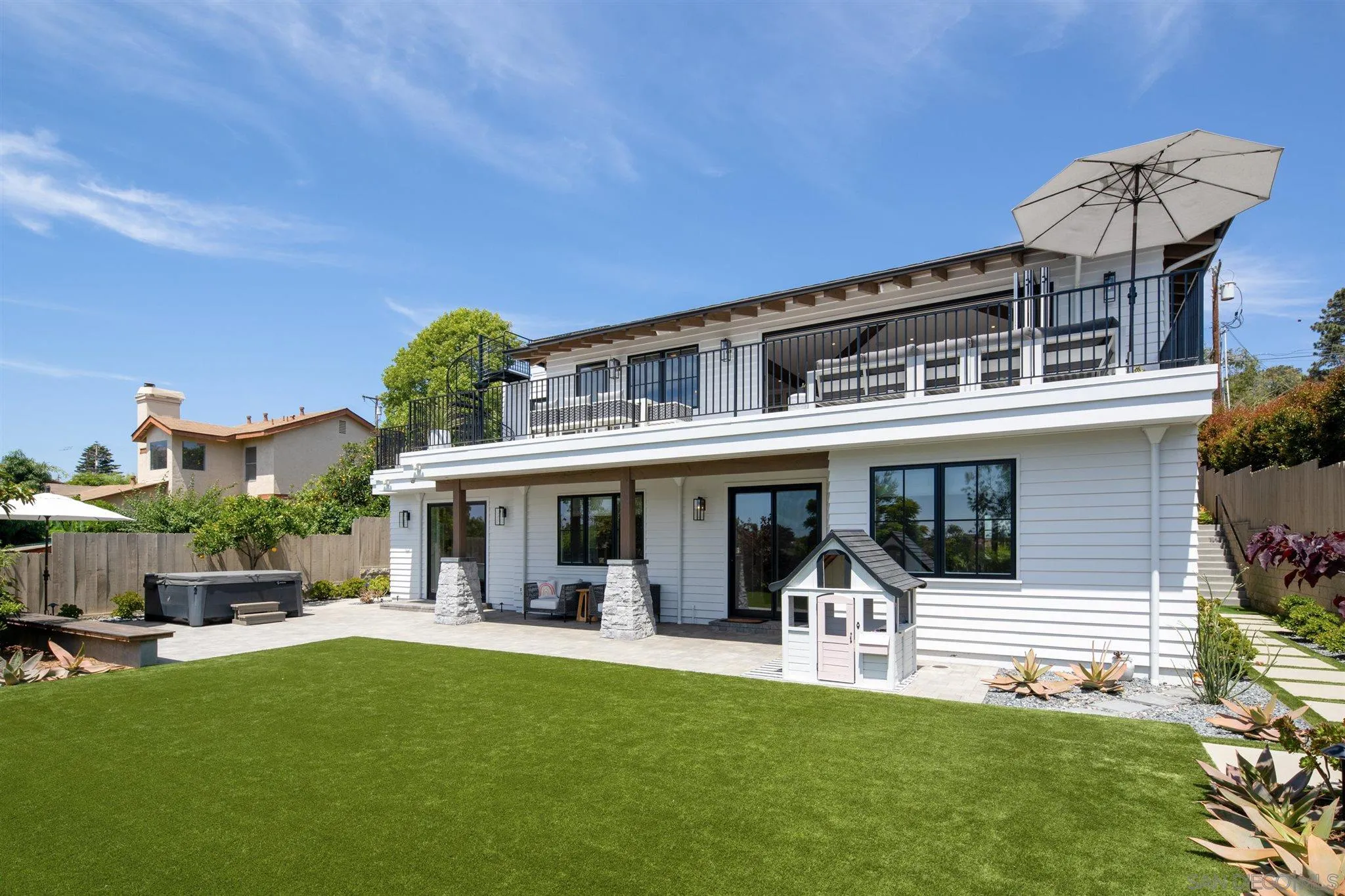 425 South Rios Avenue Solana Beach, CA 92075 - Photo 43 of 50 a front view of a house with a yard table and chairs