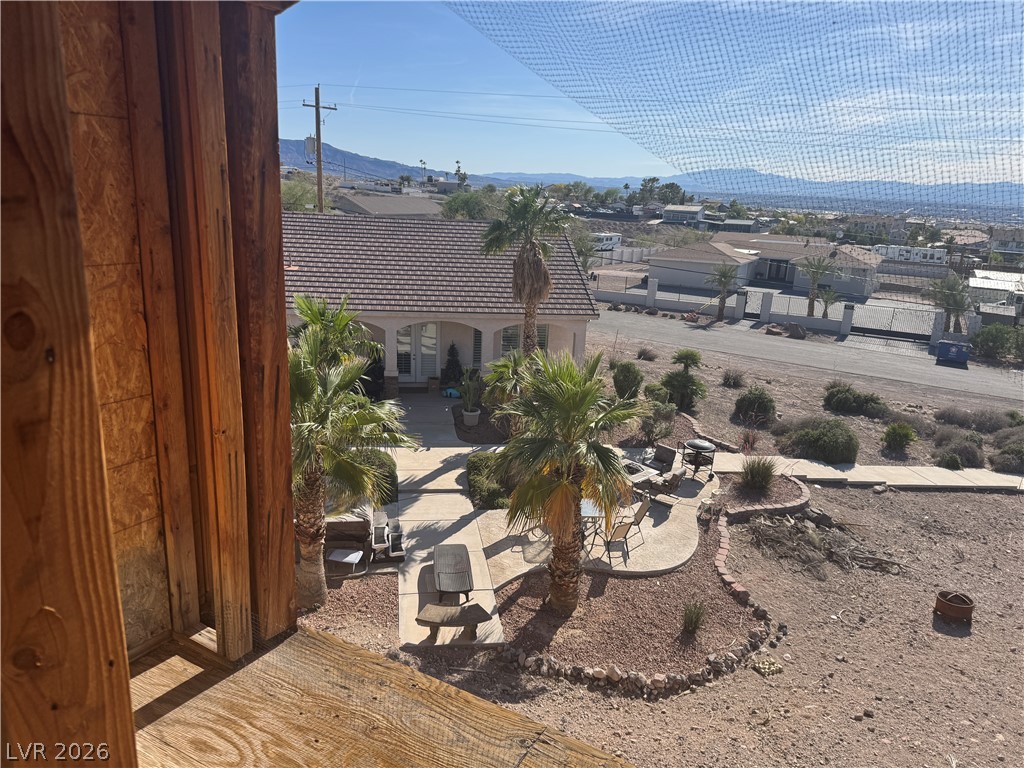 622 North Parawan Street Henderson, NV 89015 - Photo 2 of 3 A well-maintained outdoor patio area overlooks a neighborhood with distant mountains.