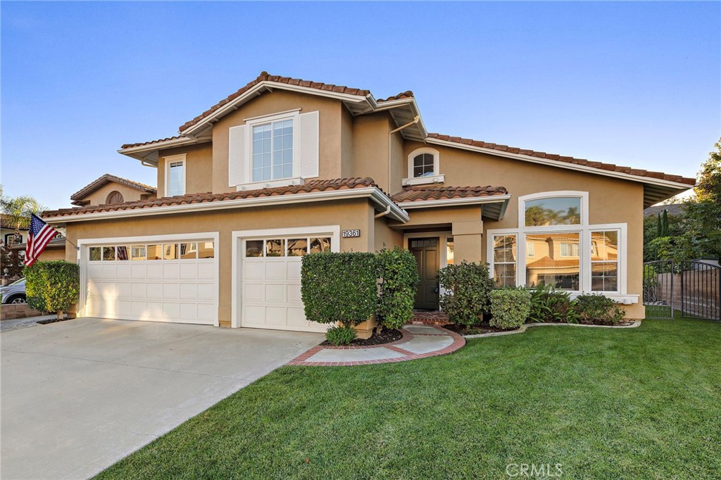 19361 Jasper Hill Road Lake Forest, CA 92679 - Photo 1 of 37 a front view of a house with a garden and plants