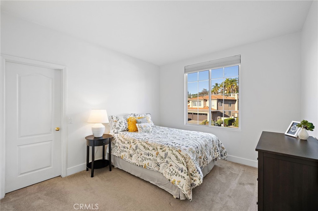 19361 Jasper Hill Road Lake Forest, CA 92679 - Photo 12 of 37 a bedroom with a bed and a window