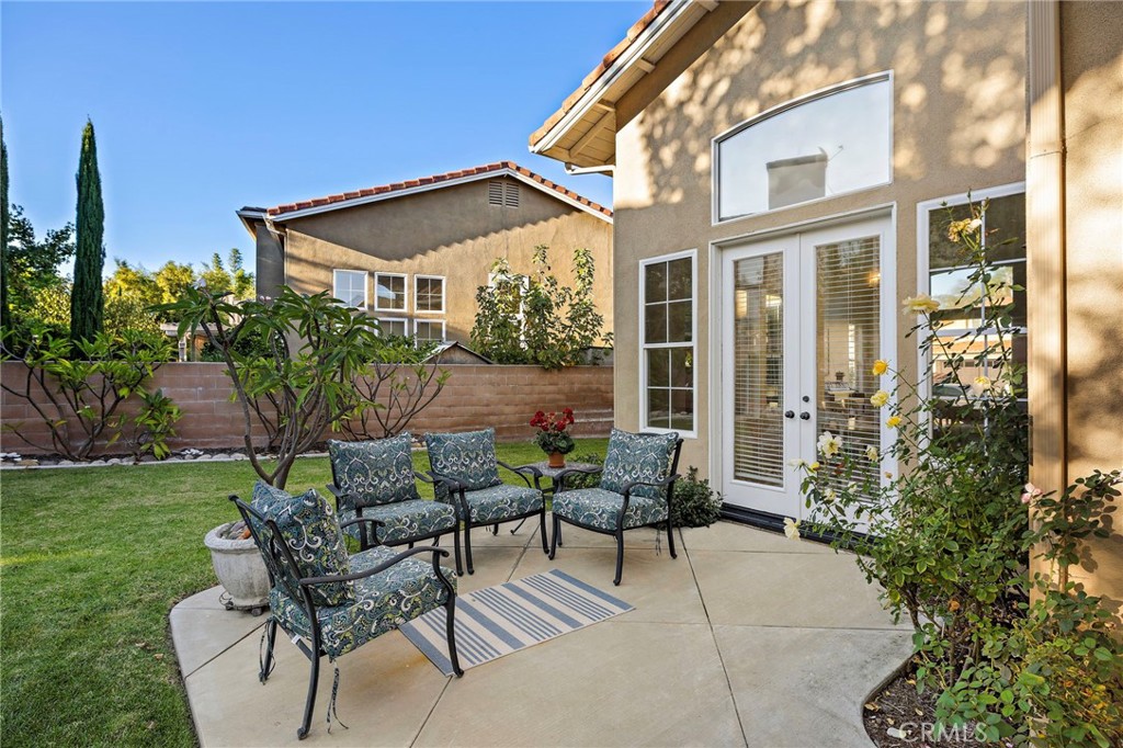 19361 Jasper Hill Road Lake Forest, CA 92679 - Photo 15 of 37 a view of patio with a table and chairs and potted plants