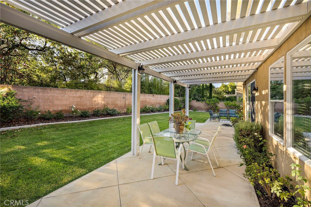 19361 Jasper Hill Road Lake Forest, CA 92679 - Photo 17 of 37 a view of a patio with table and chairs and potted plants