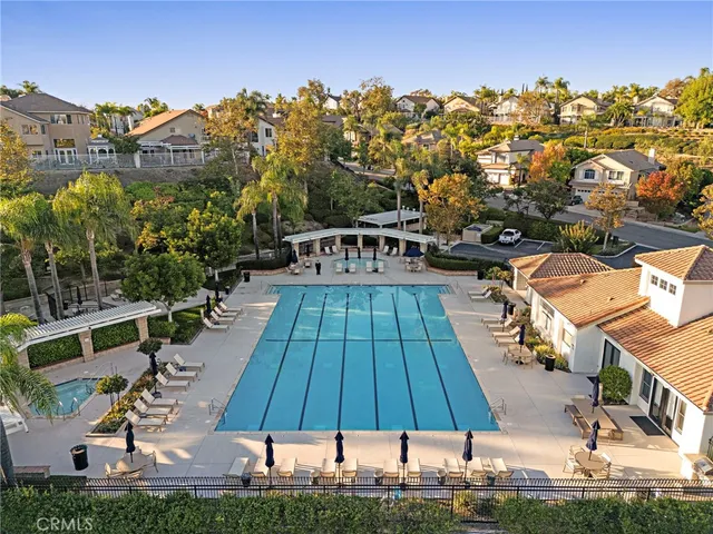 an aerial view of multiple houses with yard