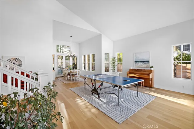 a living room with furniture a window and a table