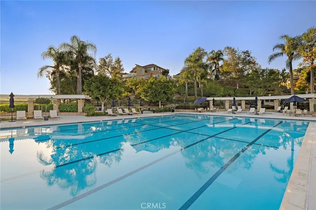 a view of a swimming pool with a yard