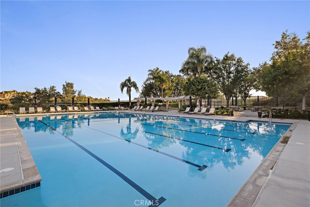 19361 Jasper Hill Road Lake Forest, CA 92679 - Photo 22 of 37 a view of swimming pool with outdoor seating and yard in the back