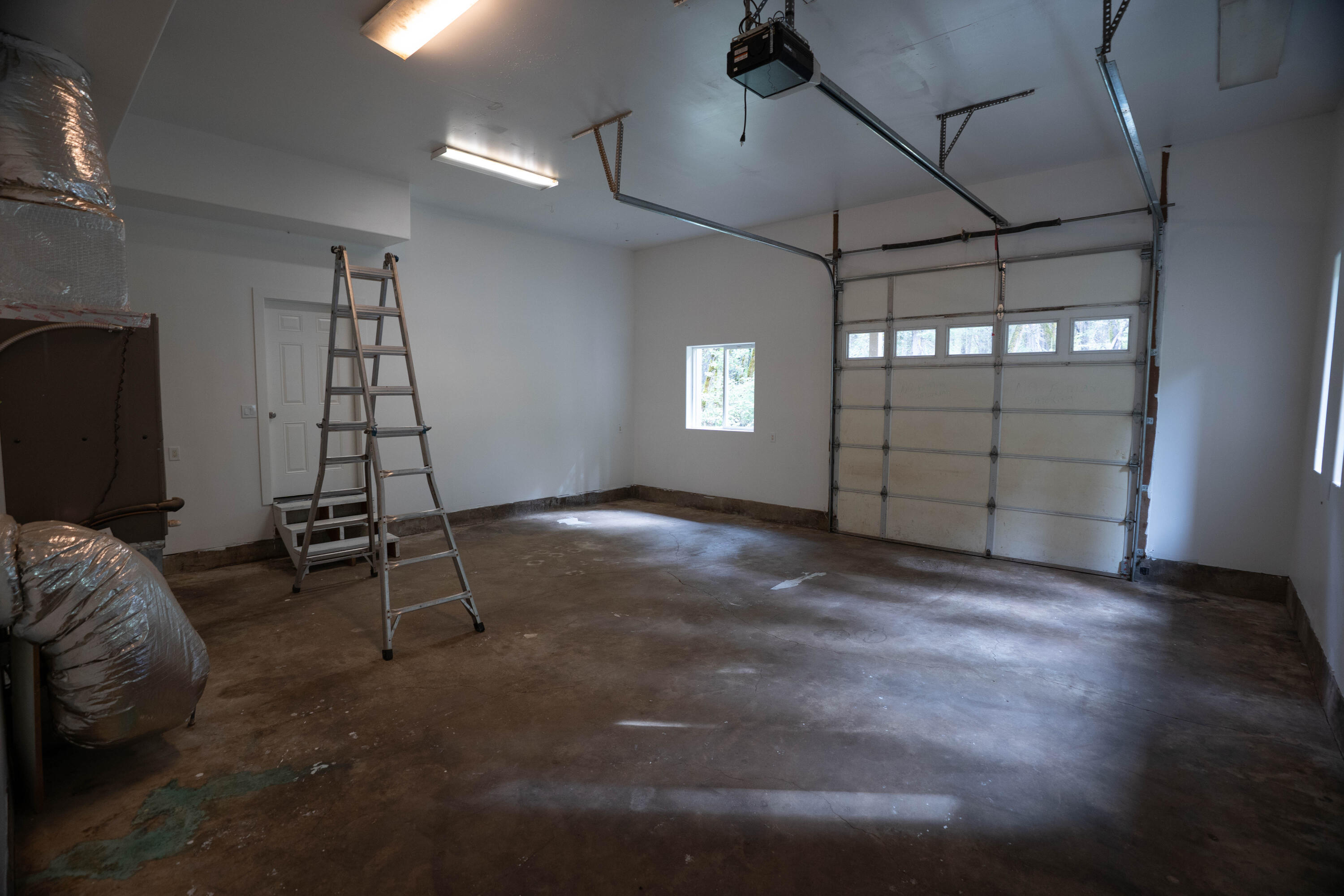 709 Pinewood Way Cave Junction, OR 97523 - Photo 23 of 24 a view of a room with gym equipment and a window