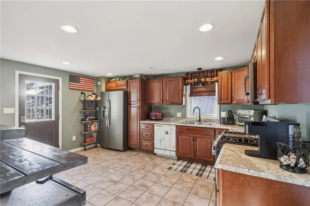 a kitchen with a sink cabinets and window