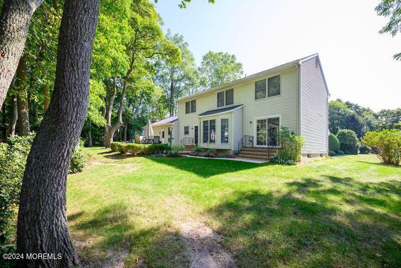 14 Spicy Pond Road Howell, NJ 07731 - Photo 25 of 35 a view of house with backyard and a garden