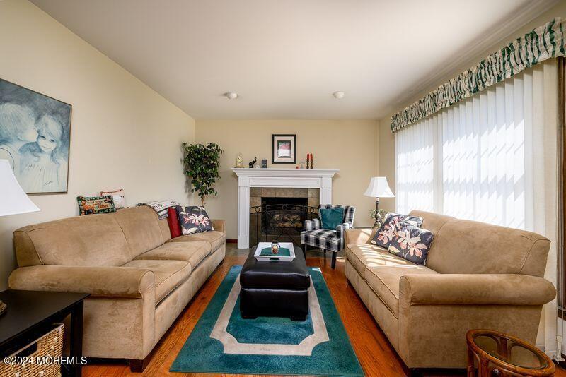 14 Spicy Pond Road Howell, NJ 07731 - Photo 8 of 35 a living room with furniture and a fireplace