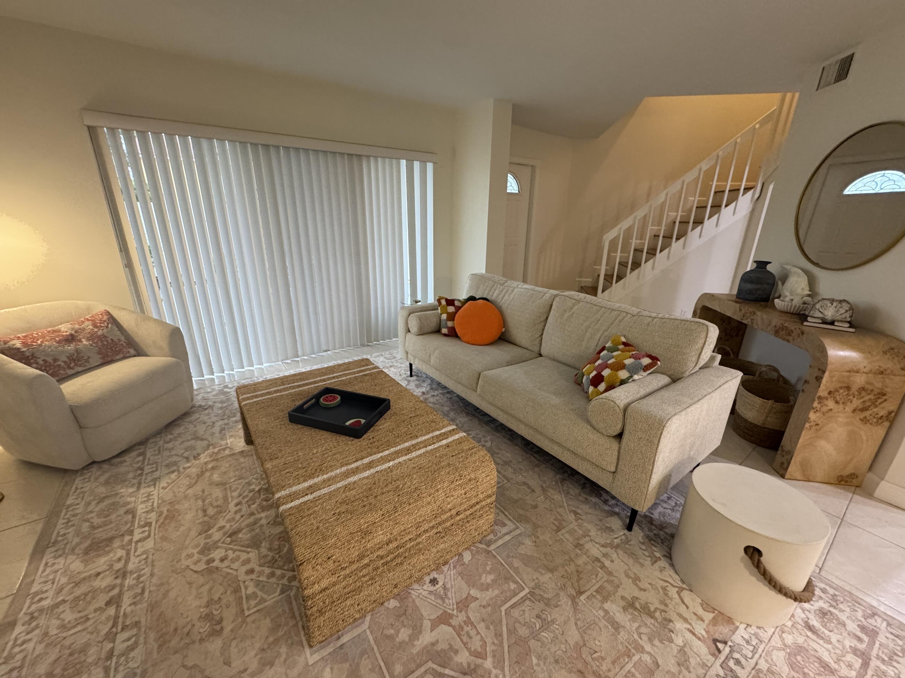 176 Seabreeze Circle Jupiter, FL 33477 - Photo 14 of 28 a living room with furniture and a window