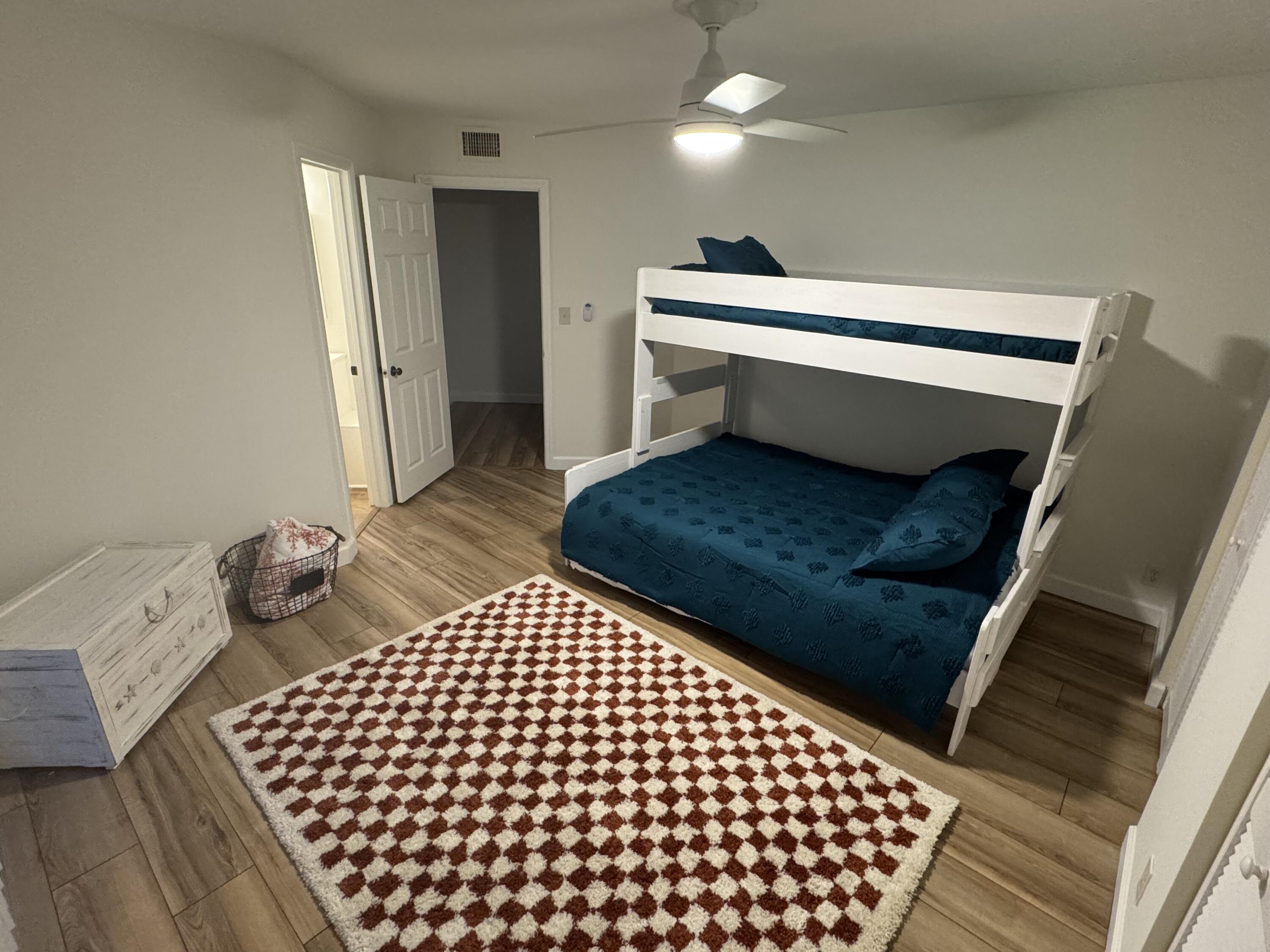 176 Seabreeze Circle Jupiter, FL 33477 - Photo 16 of 28 a living room with a couch