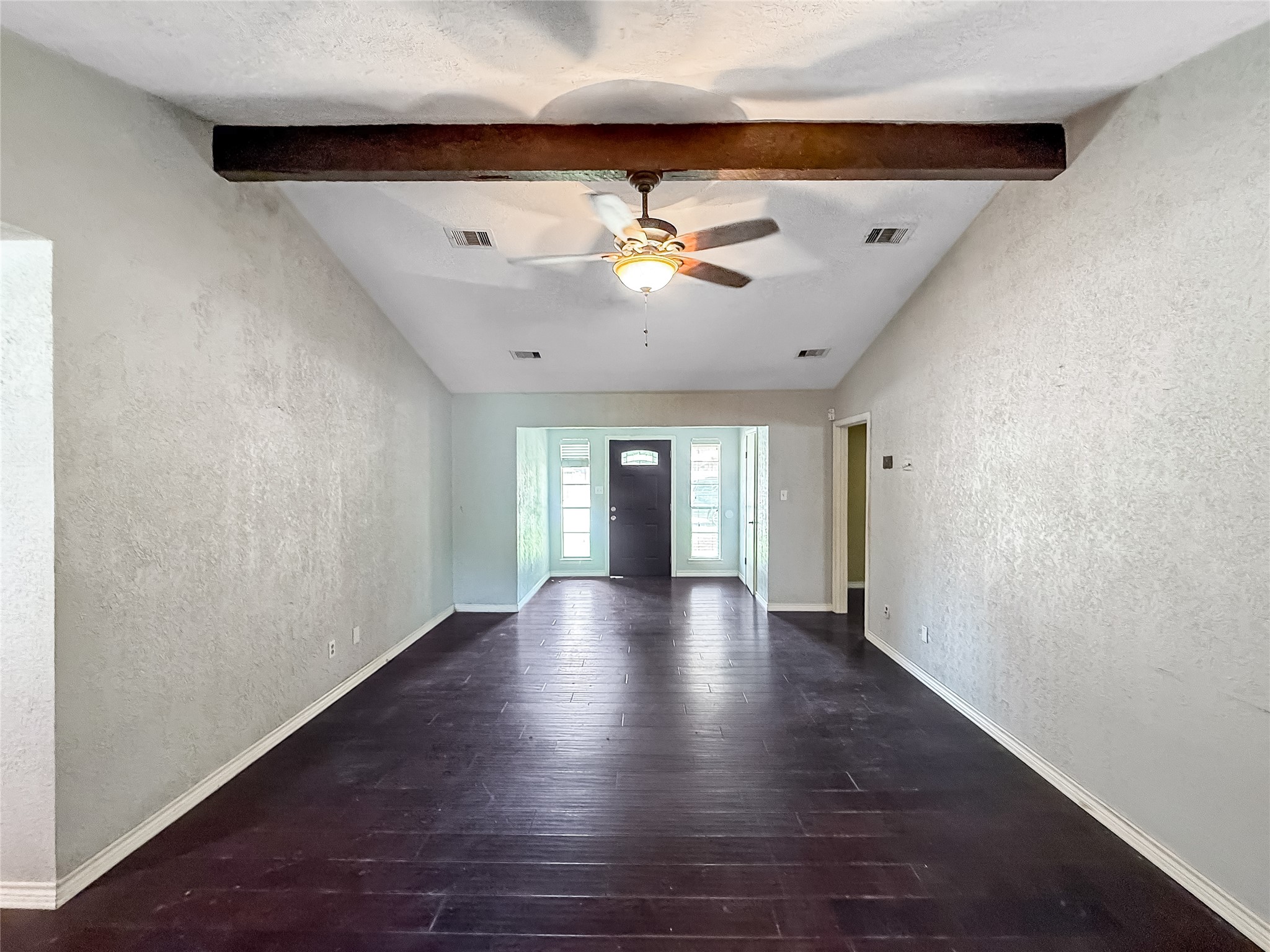 1413 Bay Ridge Boulevard Bay City, TX 77414 - Photo 8 of 20 wooden floor in an empty room with a window
