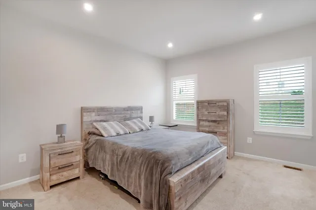 a bedroom with a bed and a cabinets