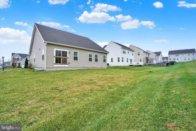 a view of a big house with a big yard