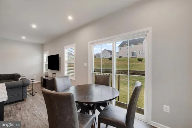 a view of a livingroom with furniture and a window