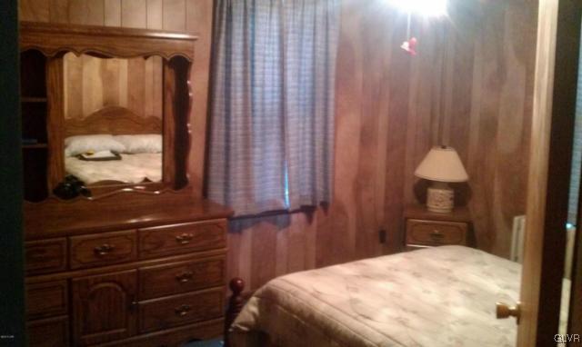 216 East Ruddle Street Coaldale, PA 18218 - Photo 7 of 8 a bedroom with a bed and a window