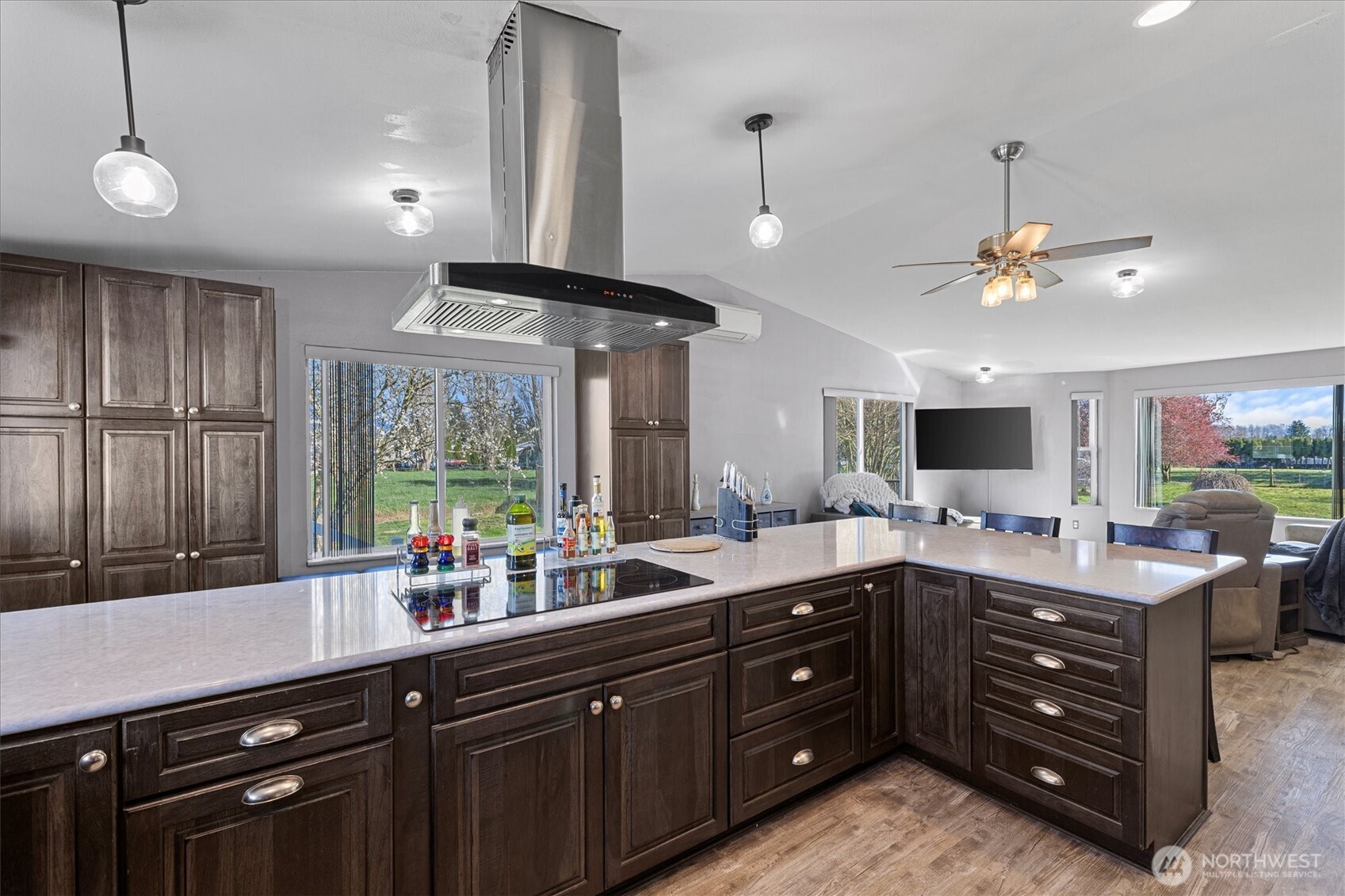 17771 Dunbar Road Mount Vernon, WA 98273 - Photo 11 of 38 a kitchen with a sink stove and wooden cabinets