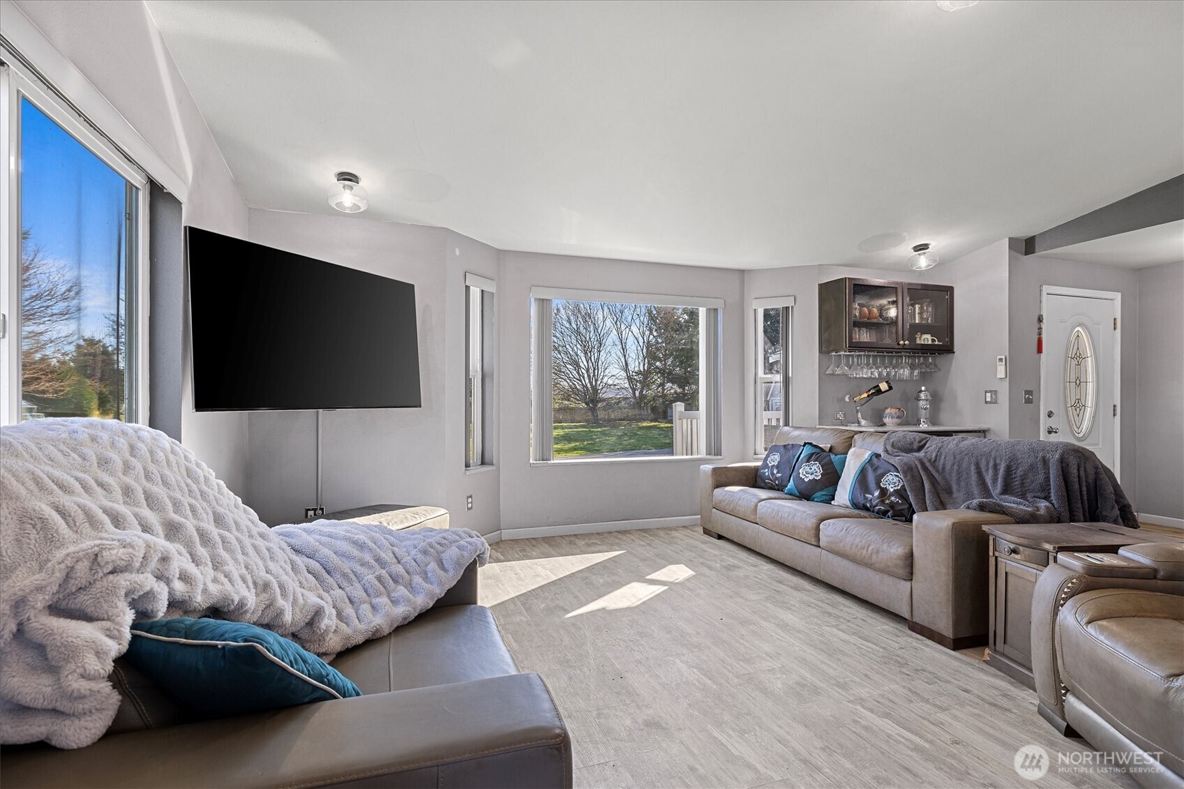 17771 Dunbar Road Mount Vernon, WA 98273 - Photo 12 of 38 a living room with furniture and a flat screen tv