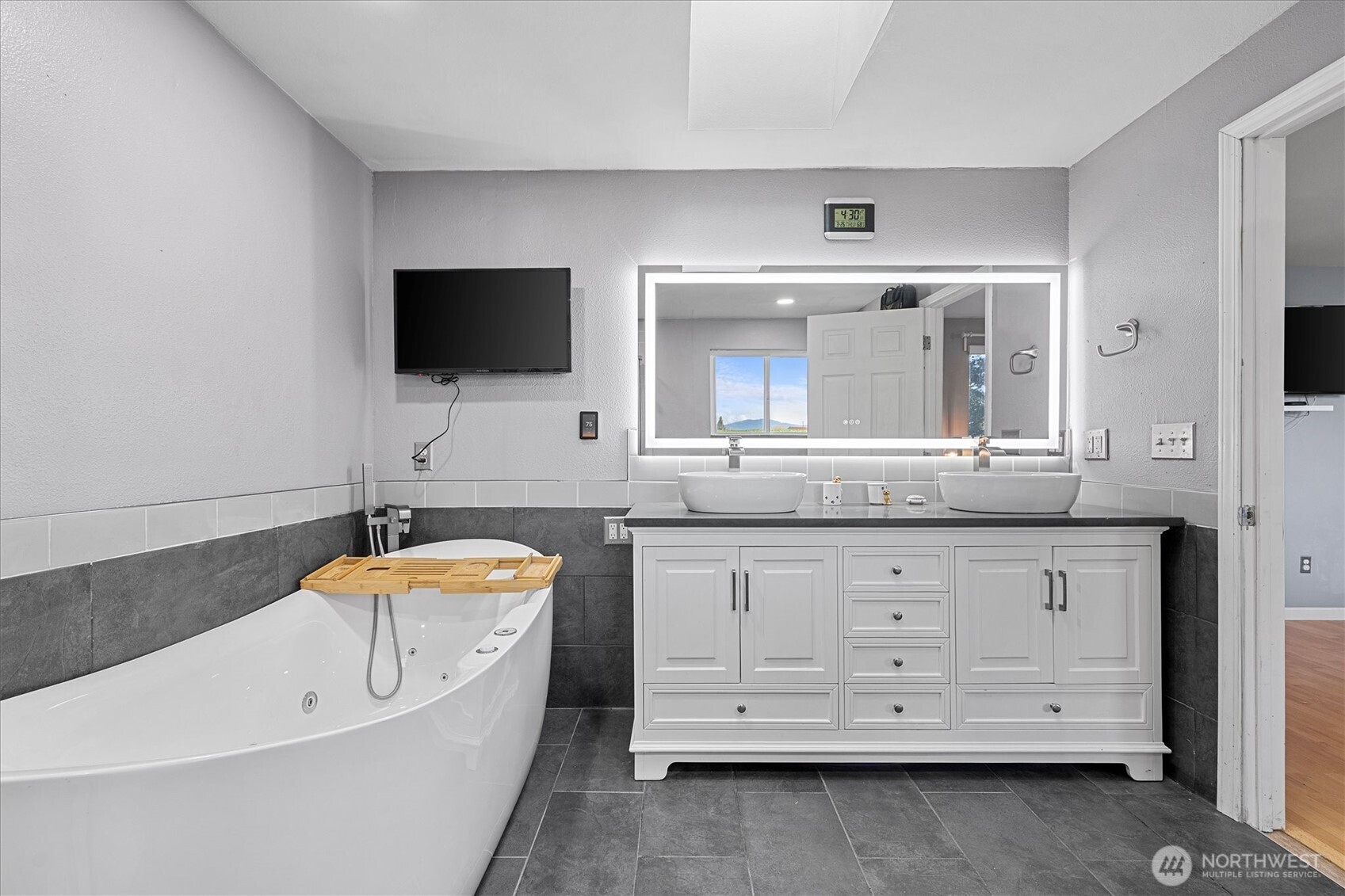17771 Dunbar Road Mount Vernon, WA 98273 - Photo 17 of 38 a spacious bathroom with a double vanity sink mirror and bathtub