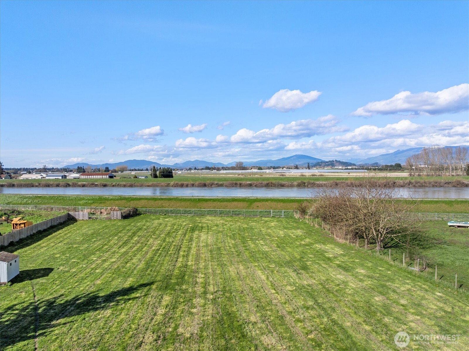 17771 Dunbar Road Mount Vernon, WA 98273 - Photo 27 of 38 a view of a lake with houses in the background