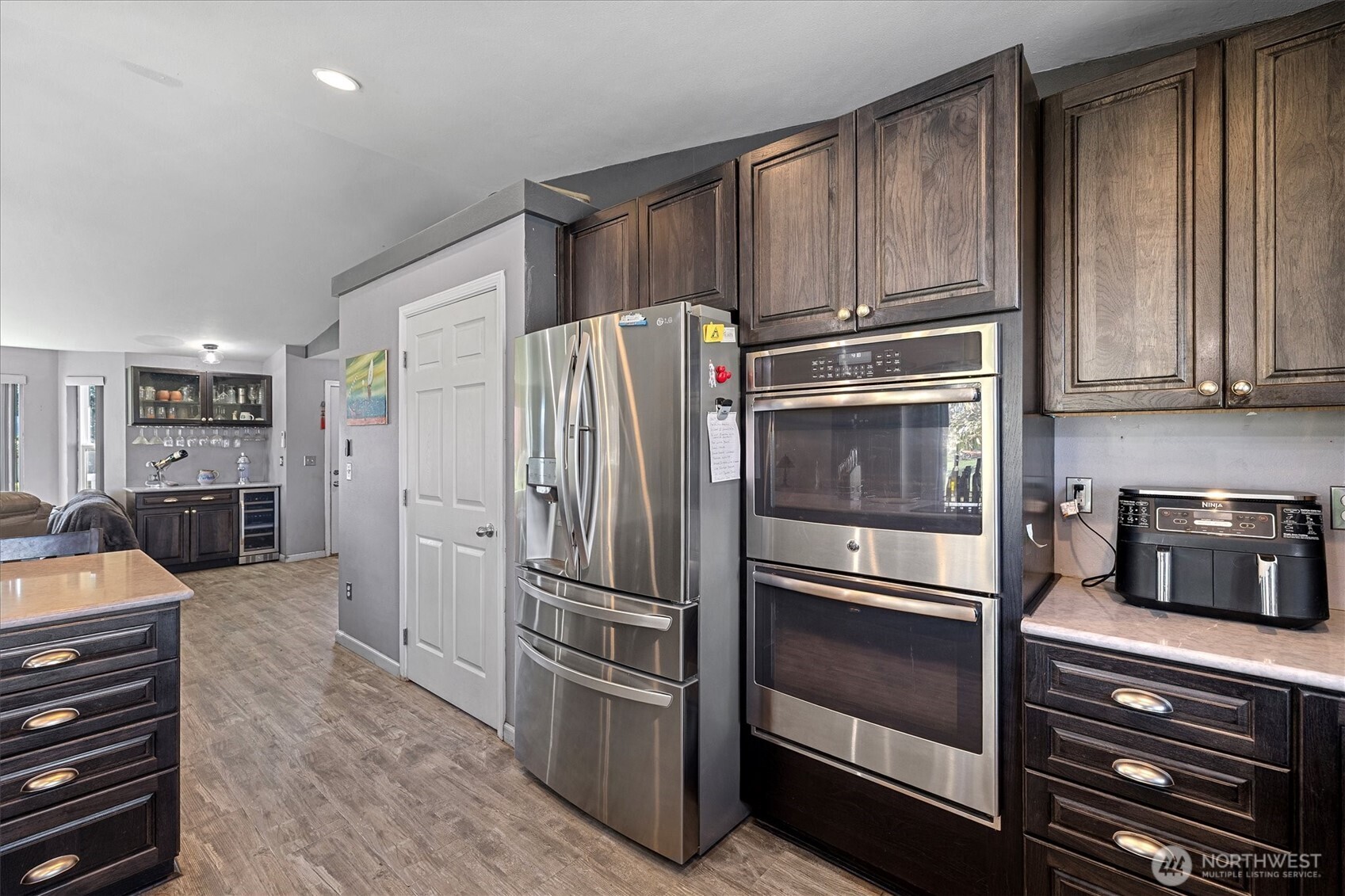 17771 Dunbar Road Mount Vernon, WA 98273 - Photo 7 of 38 a kitchen with granite countertop stainless steel appliances and refrigerator