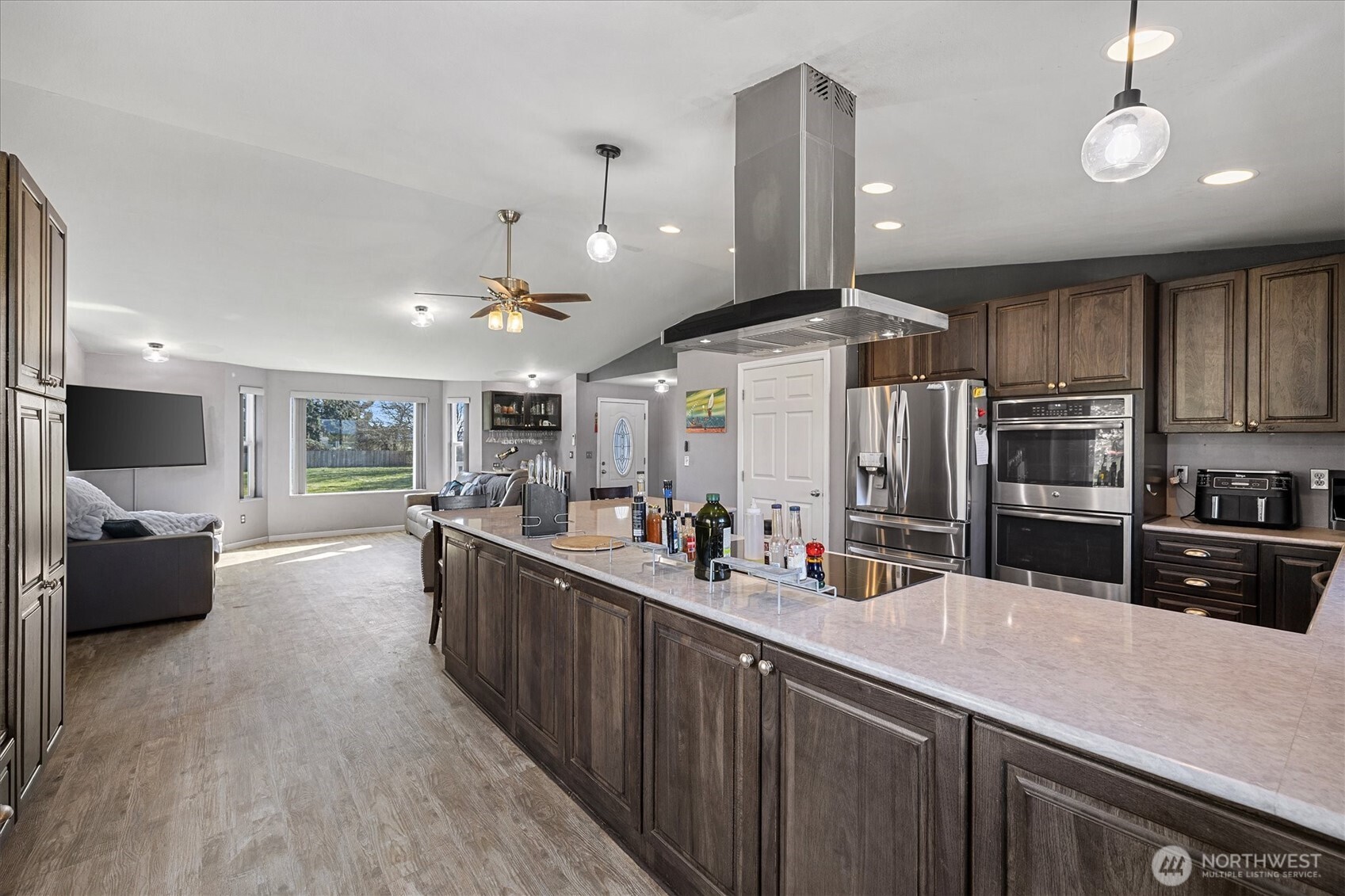 17771 Dunbar Road Mount Vernon, WA 98273 - Photo 9 of 38 a kitchen with stainless steel appliances kitchen island granite countertop a sink and cabinets
