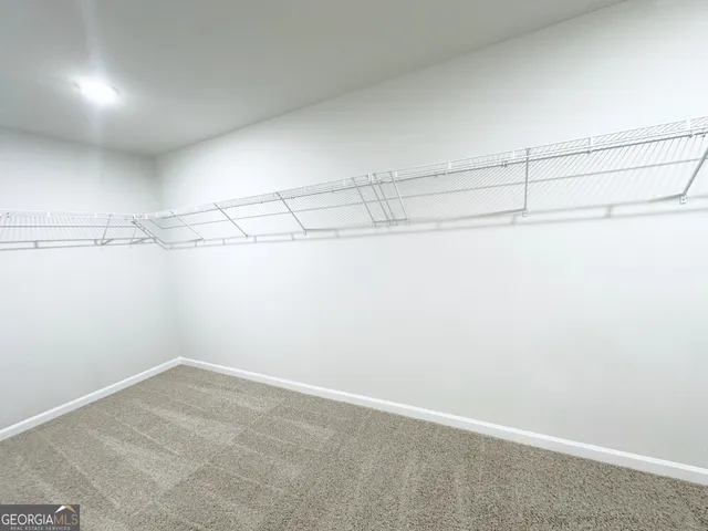 a view of a room with racks on the wall