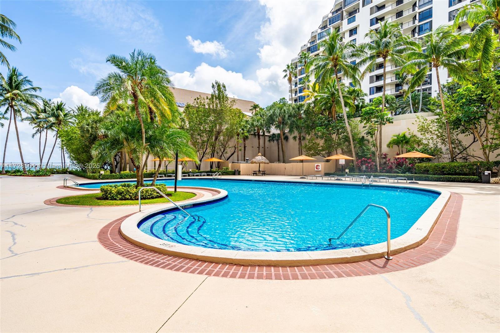 540 Brickell Key Drive, Unit 1021 Miami, FL 33131 - Photo 22 of 23 a view of a swimming pool with a yard