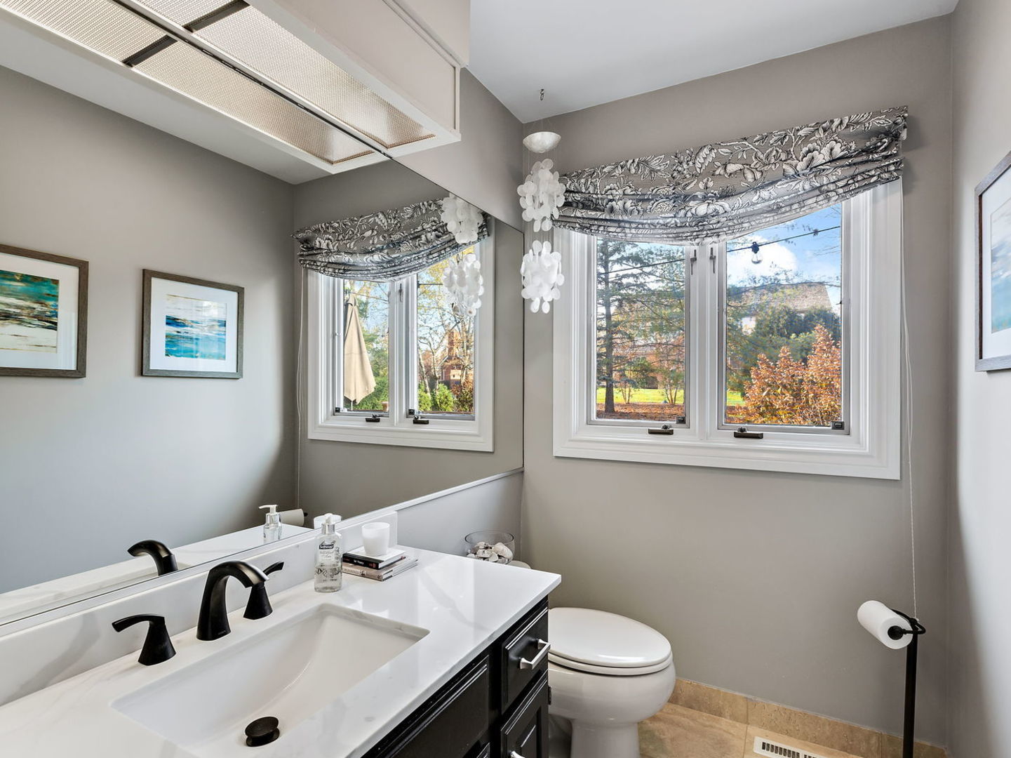 730 Valley Road Lake Forest, IL 60045 - Photo 11 of 33 a bathroom with a sink mirror and a toilet
