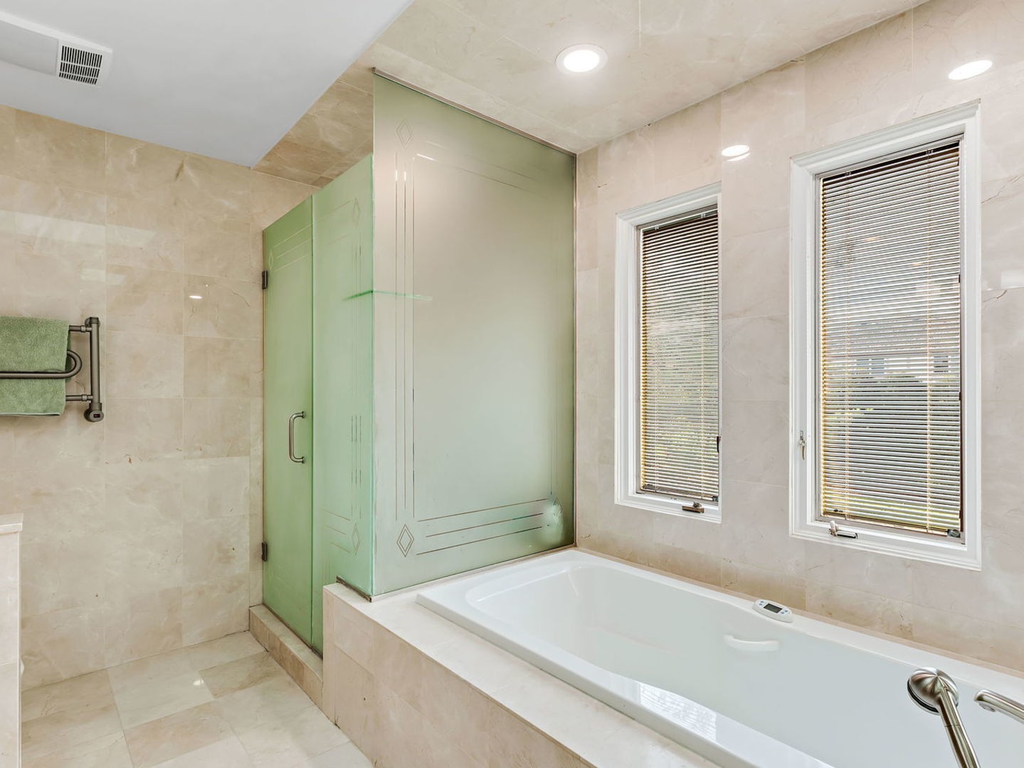 730 Valley Road Lake Forest, IL 60045 - Photo 17 of 33 a spacious bathroom with a bathtub and shower