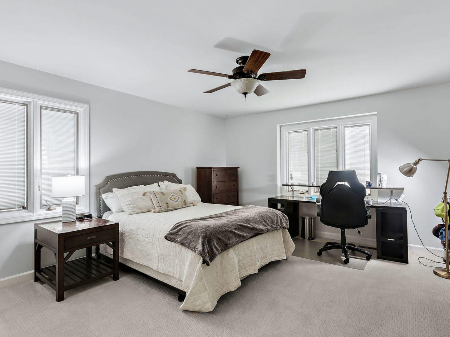 730 Valley Road Lake Forest, IL 60045 - Photo 22 of 33 a spacious bedroom with a bed chairs and a window