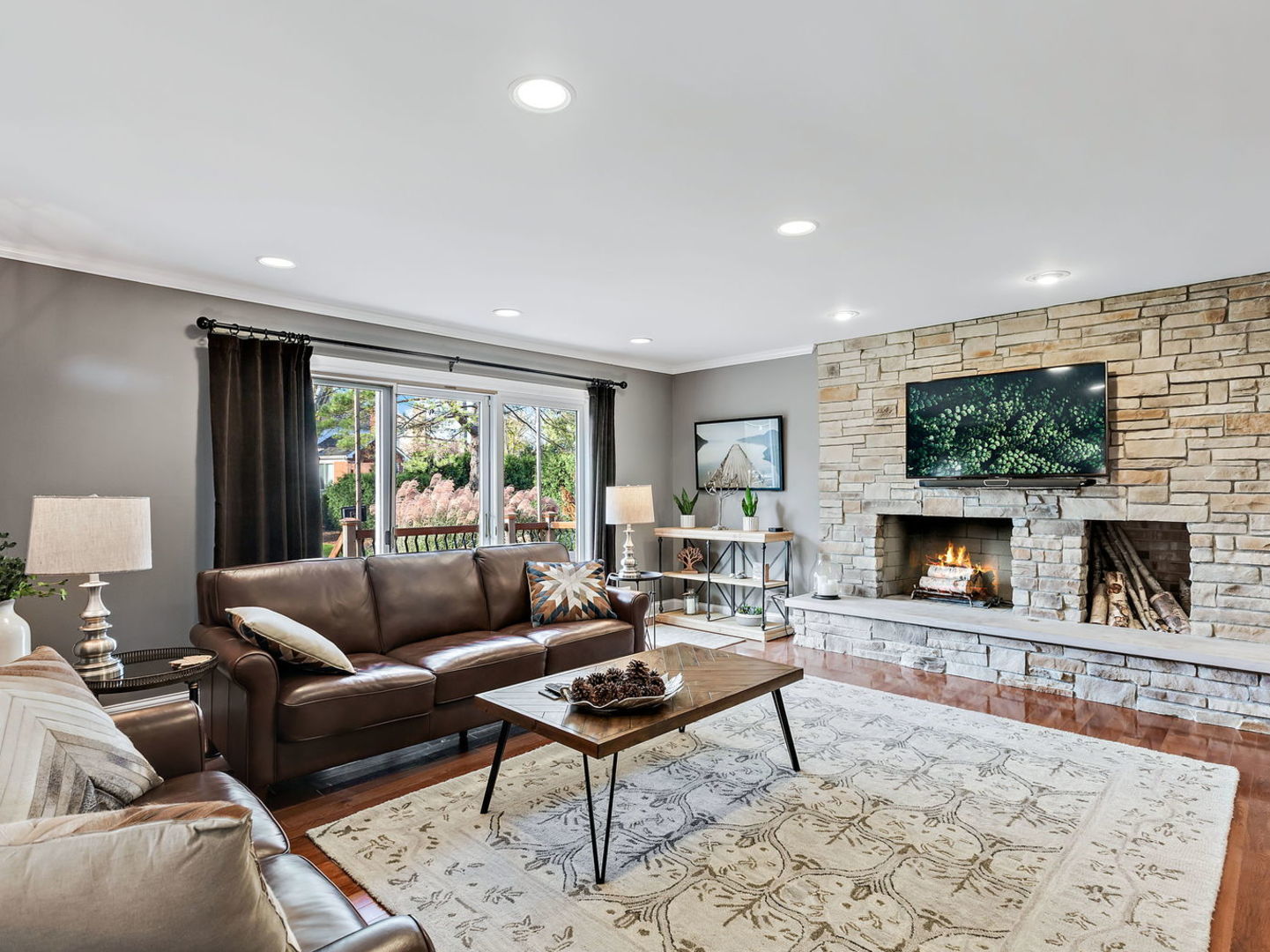 730 Valley Road Lake Forest, IL 60045 - Photo 8 of 33 a living room with furniture a flat screen tv and a fireplace