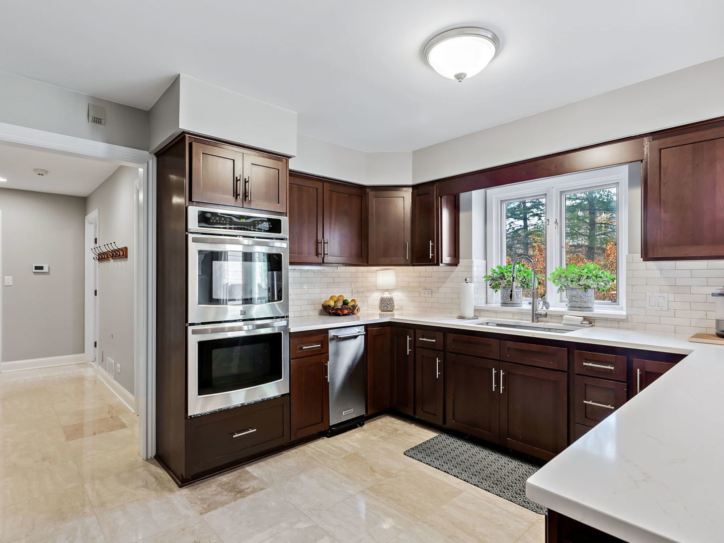 730 Valley Road Lake Forest, IL 60045 - Photo 10 of 33 a kitchen with stainless steel appliances granite countertop a stove a sink and a microwave