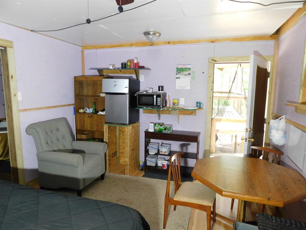 165 Rosewood Road Springhill, LA 71075 - Photo 17 of 27 a living room with furniture and a wooden floor