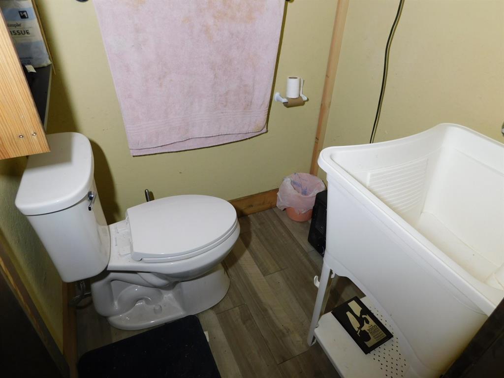 165 Rosewood Road Springhill, LA 71075 - Photo 26 of 27 a white toilet sitting next to a sink