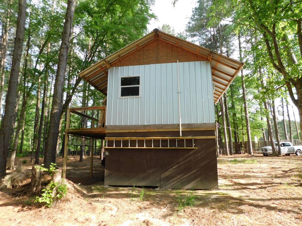 165 Rosewood Road Springhill, LA 71075 - Photo 6 of 27 a front view of a house with a yard